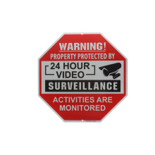 public red and white metal 24 hours monitor alarm warning road sign